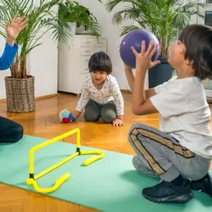 Children Playing with Ball Indoors